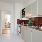 Galley Kitchen Swedish Fancy Galley Kitchen Design In Swedish Apartment Applied White Wooden Floor And Red Tile Backsplash Ideas Apartments Stylish Swedish Interior Style Apartment With Wooden Furniture Accents