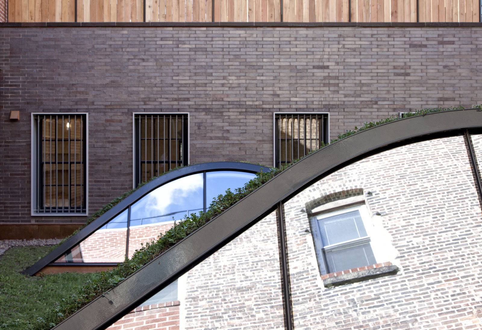 Exterior View Artist Fantastic Exterior View Of The Artist Residence With Brick Wall And Some Reflective Skylights Near It Decoration Elegant Home Decorated With Artistic And Contemporary Living Spaces