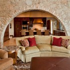 Mediterranian Family With Fascinating Mediterranean Family Room Design With Bright Yellow Colored Small Sofa Several Pillows And Bright Stone Curvy Wall Decoration Lovely And Small Sofa Furniture Examples For Your Inspiration