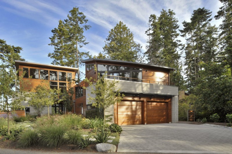 Concrete Courtyard Ornamental Freshening Concrete Courtyard With Colorful Ornamental Plants And Stone Path In Front Of Modern Sunset Point House Dream Homes Sustainable Contemporary Home With Wood And Stained Glass Facade