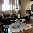 Living Room Sofas Good Living Room With Black Sofas Facing Glass Table Feat Flower And Horse Sculpture Beside Glossy Chairs Decoration Dramatic Yet Elegant Bold Black Sofas For Exquisite Interior Decorations