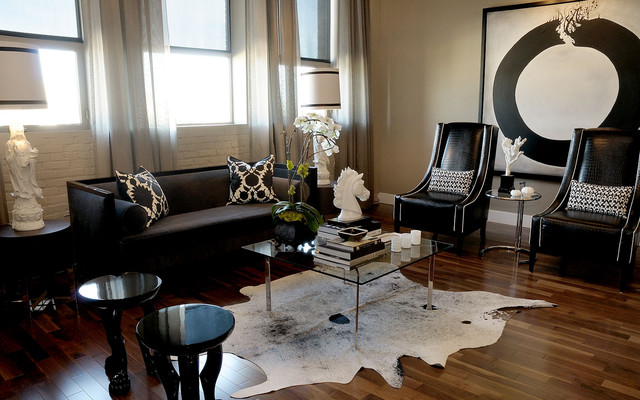 Living Room Sofas Good Living Room With Black Sofas Facing Glass Table Feat Flower And Horse Sculpture Beside Glossy Chairs Decoration Dramatic Yet Elegant Bold Black Sofas For Exquisite Interior Decorations