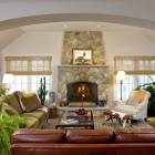 Stone Cladded Artistic Gorgeous Traditional Stone Clad  Fireplace With Artistic Overmantle Set As Vital Point In Living Room With Red Sofas Decoration Bright And Cheerful Home Decorating With Beautiful Sofa Furniture
