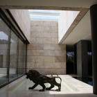 Lion Statue Built Great Lion Statue Applied On Built In Floor Glass Wall Open Space And Neutral Brick Wall Construction In Open Up Ceiling Design Dream Homes Spanish Home Design With Futuristic And Elegant Cantilevered Decorations