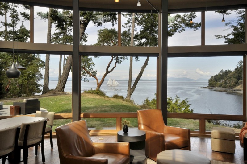 Ocean View Point Imposing Ocean View From Sunset Point House With Glass Bay Window Sleek Leather Armchairs And Round Coffee Table Dream Homes Sustainable Contemporary Home With Wood And Stained Glass Facade