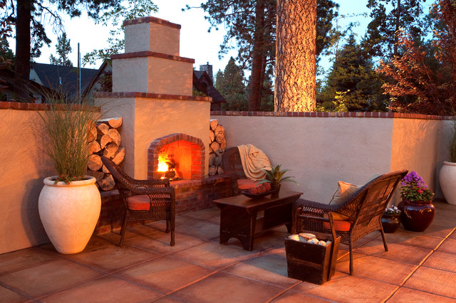 Outdoor Fireplace The Imposing Outdoor Fireplace Designs At The Afternoon That Wooden Table Feat Planters And Trees Surrounding The Area Decoration  Classic Outdoor Fireplace Designs For Impressive Exterior Decoration