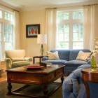 Blue Sofas Room Impressing Blue Sofas In Living Room With Glossy Wooden Table Feat Plate And Book That Sheer Curtains Add Nice The Area Furniture Cool Blue Sofas Generate Breezy Impression In Your Living Room
