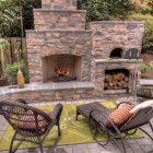Outdoor Fireplace Green Impressing Outdoor Fireplace Designs With Green Carpet Feat Black Chairs And Nice Pillows Which Add Nice The Area Decoration Classic Outdoor Fireplace Designs For Impressive Exterior Decoration