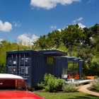 Gray Molded Container Impressive Gray Molded Wall Patterned Container Guest House With Simple Terrace Outside Furnished Red Chairs And White Table Dream Homes Stunning Shipping Container Home With Stylish Architecture Approach