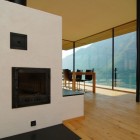 Room Design Am Impressive Room Design Of Wohnhaus Am Walensee Residence With Soft Brown Wooden Wall And Cozy Fireplace Which Has Black Colored Mantle Architecture Beautiful Rectangular Lake Home With Wood And Concrete Elements
