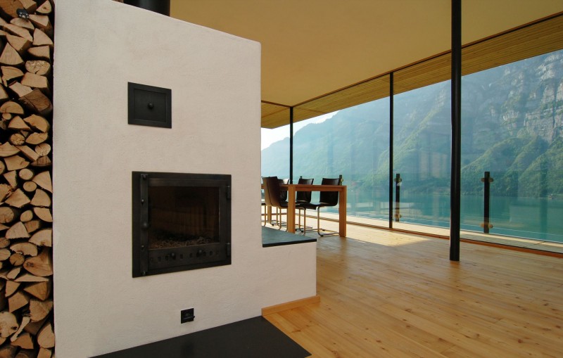 Room Design Am Impressive Room Design Of Wohnhaus Am Walensee Residence With Soft Brown Wooden Wall And Cozy Fireplace Which Has Black Colored Mantle Architecture Beautiful Rectangular Lake Home With Wood And Concrete Elements