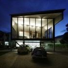 Home Building Transparency Industrial Home Building With Bright Transparency Seen By Night With Uncovered Transparent Wall By Drapes Dream Homes Affordable Contemporary Home For Your Perfect Resting Place