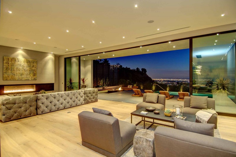 White Gray Installed Inspiring White Gray Tufted Sofas Installed With Fireplace On White Brown Painted Wall And Yellow Wall Art For Spectacular Views Over Los Angeles Dream Homes  Fascinating Contemporary House With Spectacular City Scenery