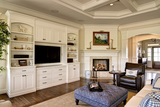 White Tv Inside Interesting White TV Cabinet Design Inside The Traditional Family Room With Tufted Coffee Table And Leather Armchair Decoration 20 Elegant And Beautiful TV Cabinets Made Of Wooden Material And Elements
