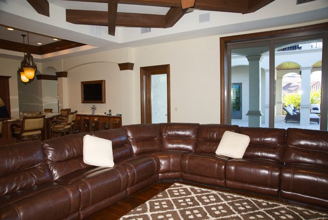 Mediterranian Family Dark Marvelous Mediterranean Family Room With Dark Brown Colored Leather Sectional Sofa Several White Pillows And Dark Brown Wooden Pergola Decoration  20 Brilliant Leather Sectional Sofas That Will Fit Stunningly Into Your Family Home