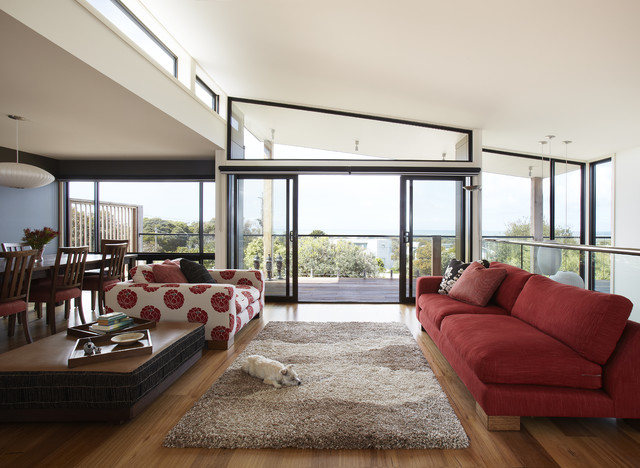 Red Sofa Red Marvelous Red Sofa With White Red Blossom Patterned Lounge Installed On Wooden Floor In Beach Style Living Room Decoration  20 Vibrant And Bright Red Sofas For Chic Living Room With Personality