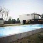White Three Pool Mesmerizing White Three Beside Swimming Pool In M House In Singera Beautified With Decorative Stone Near The Pool Dream Homes Stunning Modern Home Design With Concrete Walls And Glass Materials