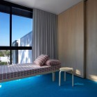 Bedroom With Bed Modern Bedroom With Modern Small Bed And Wood Bar Stools Large Glass Window Stylish Wood Wardrobe Blue Carpet In Luff Residence Architecture Astonishing Contemporary Concrete Home With Minimalist Interior Features