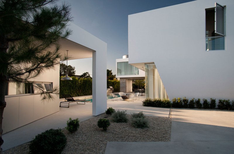 Details In Family Modern Details In The Modern Family Residence Courtyard With Blue Pool And Black Beach Chair Near It Dream Homes  Duplex Contemporary Concrete Home With Outdoor Green Gardens For Family