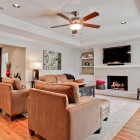 Family Of Area Modern Family Of Living Room Area With Fan Above The Sofas Facing The Fireplace Mantel Shelves In Black Color Decoration Functional Modern Home With Fireplace Mantel Shelves And Creative Lightings