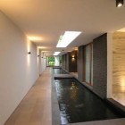 Water Cooled Swimming Modern Water Cooled House Interior Swimming Pool Idea Designed With Narrowed Entryway And Skylight As Lighting Decoration Elegant And Beautiful Home Design Presented By The Water-Cooled House