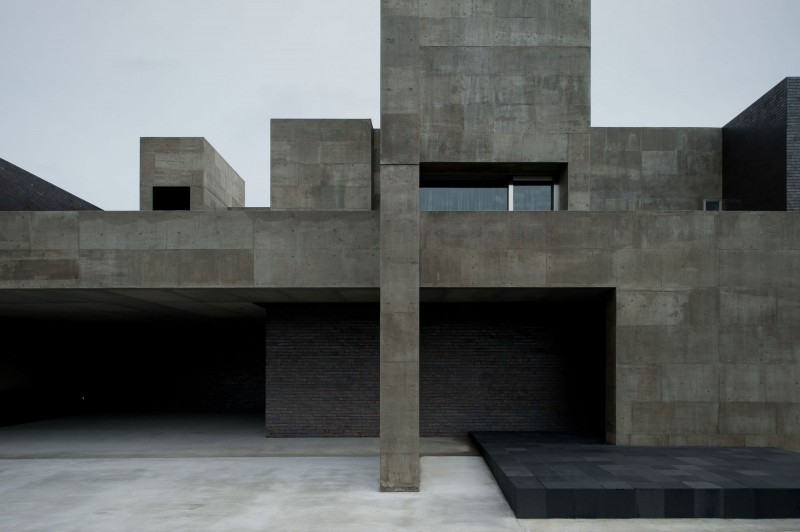 Facade View Of Mysterious Facade View Of House Of Silence Seen From Street Side Displaying Open Garage And Carport With Hardscape Dream Homes  Sophisticated Modern Japanese Home With Concrete Construction Of Shiga Prefecture