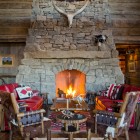 Rustic Family With Old Rustic Family Room Design With Bamboo Chairs Feat Red Sofas Beside The Fireplace Design Decoration Vibrant Red Sofas Inspirations To Give Your Living Room A Trendy