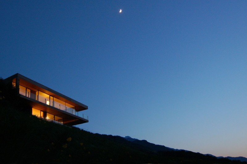 Building Design Am Outstanding Building Design Of Wohnhaus Am Walensee Residence With Soft Brown Wooden Ceiling And Bright Orange Lighting From Inside Architecture Beautiful Rectangular Lake Home With Wood And Concrete Elements