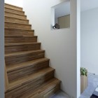 Wooden Striped Installed Outstanding Wooden Striped Constructed Ladder Installed With White Painted Wall Of White Interior Design In Hiyoshi Residence Architecture Beautiful Minimalist Home Decorating In Small Living Spaces