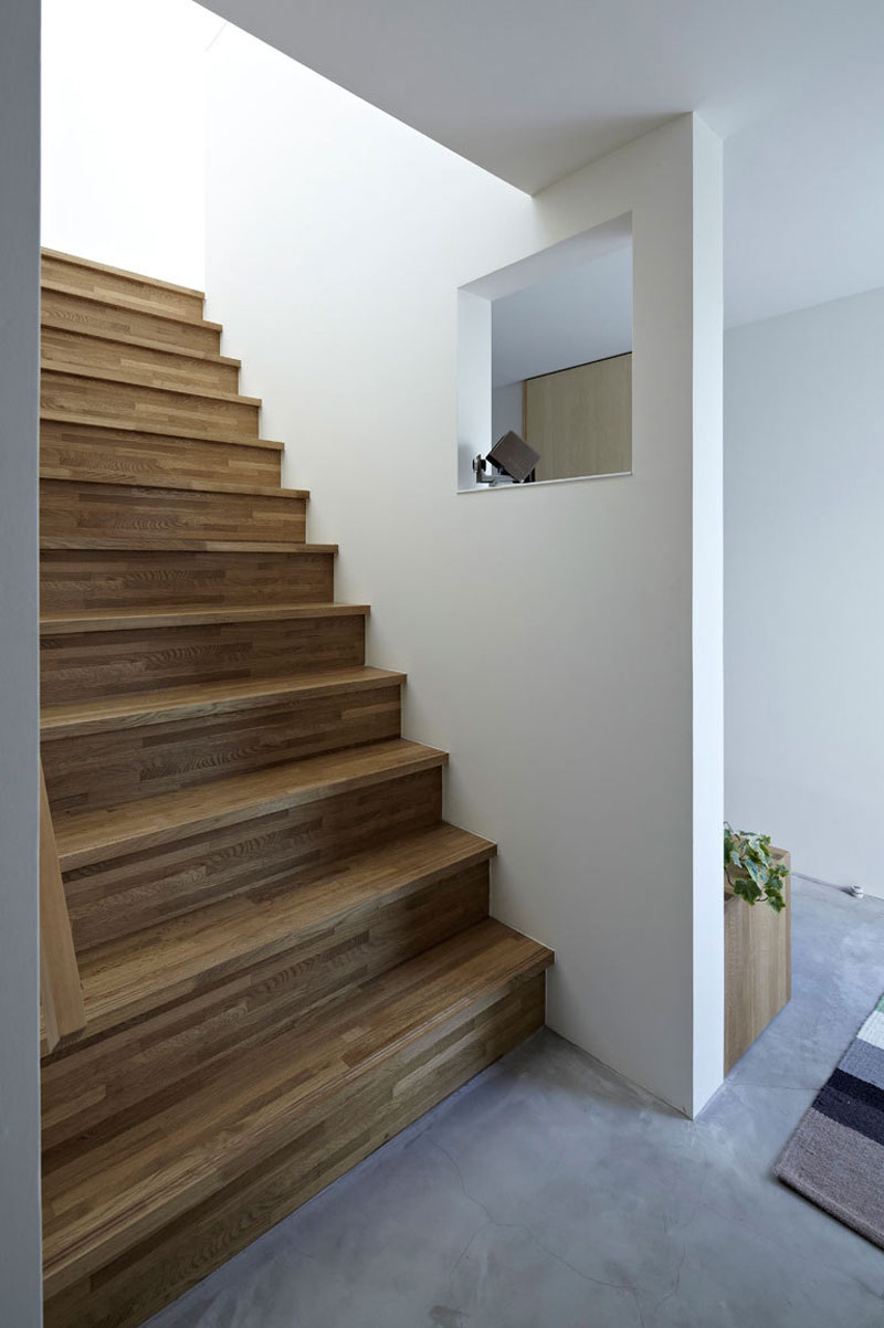 Wooden Striped Installed Outstanding Wooden Striped Constructed Ladder Installed With White Painted Wall Of White Interior Design In Hiyoshi Residence Architecture  Beautiful Minimalist Home Decorating In Small Living Spaces