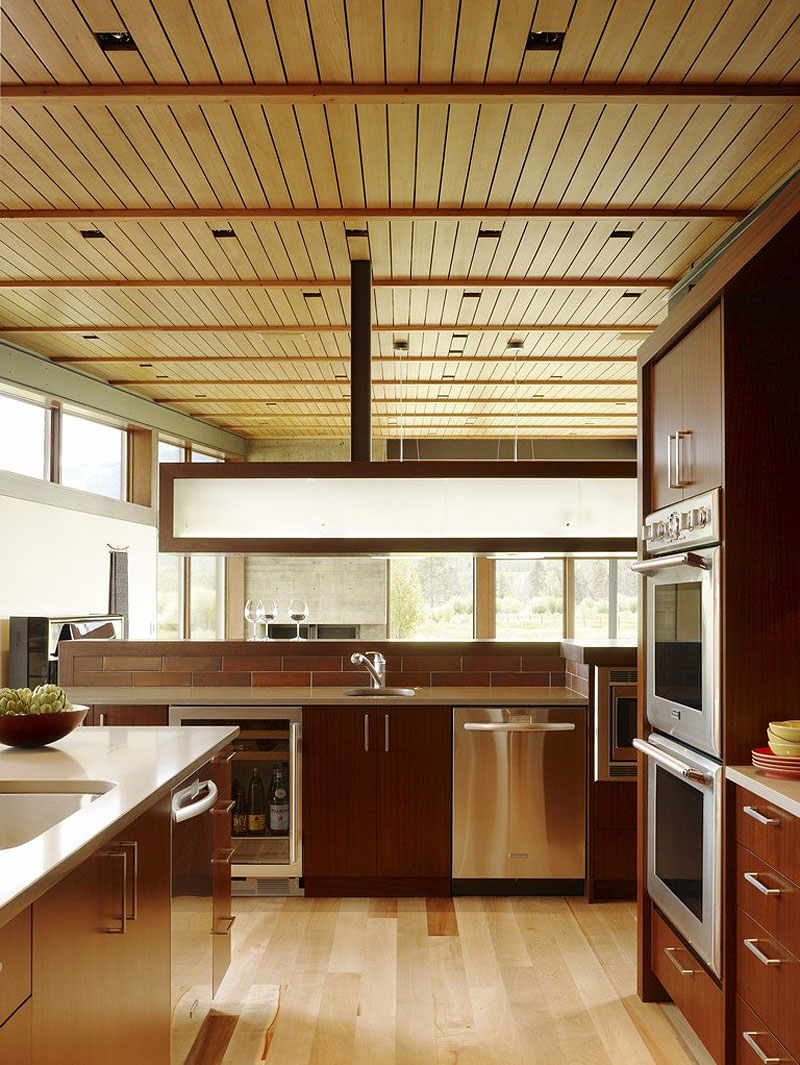 Kitchen Cabinets Kitchen Prestigious Kitchen Cabinets Coupled With Kitchen Island Involved Stove And Faucet Inside Peaks View House Installed On Wood Floor Architecture Beautiful Contemporary Home With Outdoor Dining Room And Semi-Open Terrace