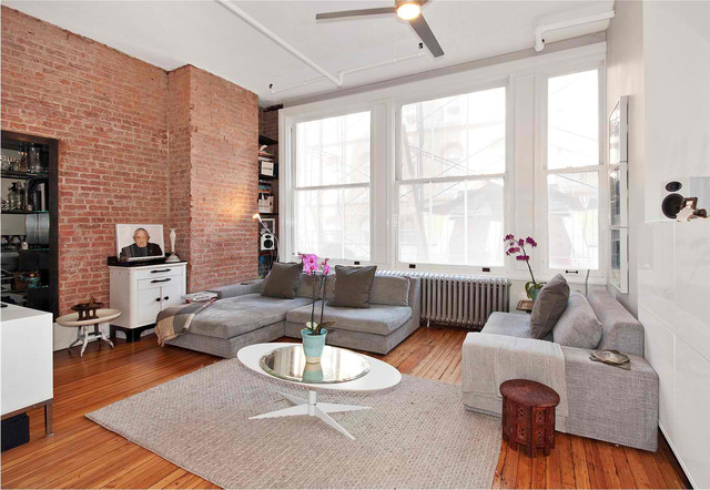 Brick Wall Oval Rustic Brick Wall Wood Floor Oval Coffee Table Grey Apartment Sofa Beautiful Flowers Sparkling Ceiling Light Small White Cabinet Decoration Lovely Beautiful Sofa Ideas For Creative Apartment Appearance