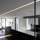 Led Light White Shiny LED Light Modern Minimalist White Kitchen Corner Glossy Pendant Lights Round Wood Dining Table And Dark Metallic Chairs In Luff Residence Architecture Astonishing Contemporary Concrete Home With Minimalist Interior Features