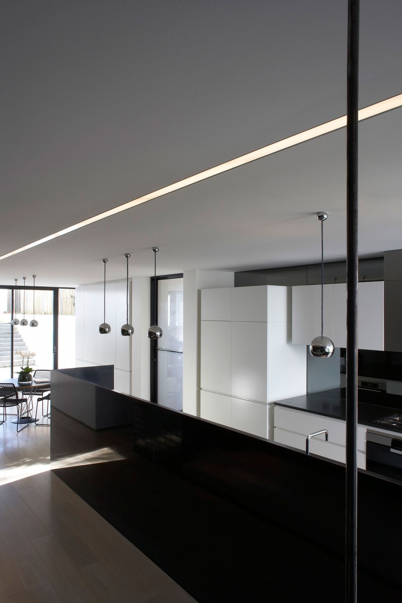 Led Light White Shiny LED Light Modern Minimalist White Kitchen Corner Glossy Pendant Lights Round Wood Dining Table And Dark Metallic Chairs In Luff Residence Architecture Astonishing Contemporary Concrete Home With Minimalist Interior Features