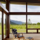 Wooden Black With Simple Wooden Black Tufted Lounge With Foot Rest Installed Near Wood Glass Sliding Doors On Wood Floor Of Peaks View House Architecture Beautiful Contemporary Home With Outdoor Dining Room And Semi-Open Terrace