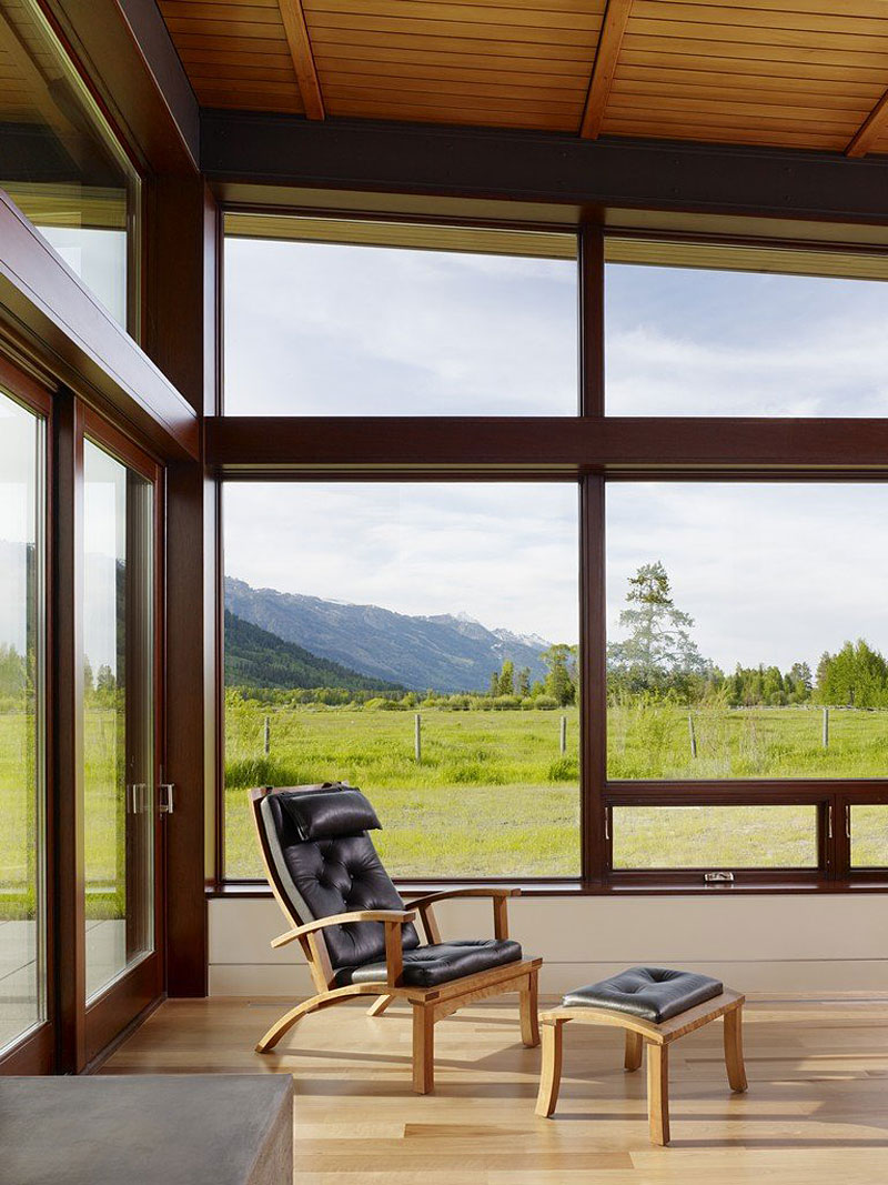 Wooden Black With Simple Wooden Black Tufted Lounge With Foot Rest Installed Near Wood Glass Sliding Doors On Wood Floor Of Peaks View House Architecture Beautiful Contemporary Home With Outdoor Dining Room And Semi-Open Terrace