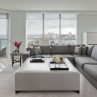 Living Room Sofas Sleek Living Room With Grey Sofas Facing White Coffee Table Feat Flower And The Glass Wall Showing Outside View Decoration Fashionable And Modern Grey Sofas For White Interior Colors