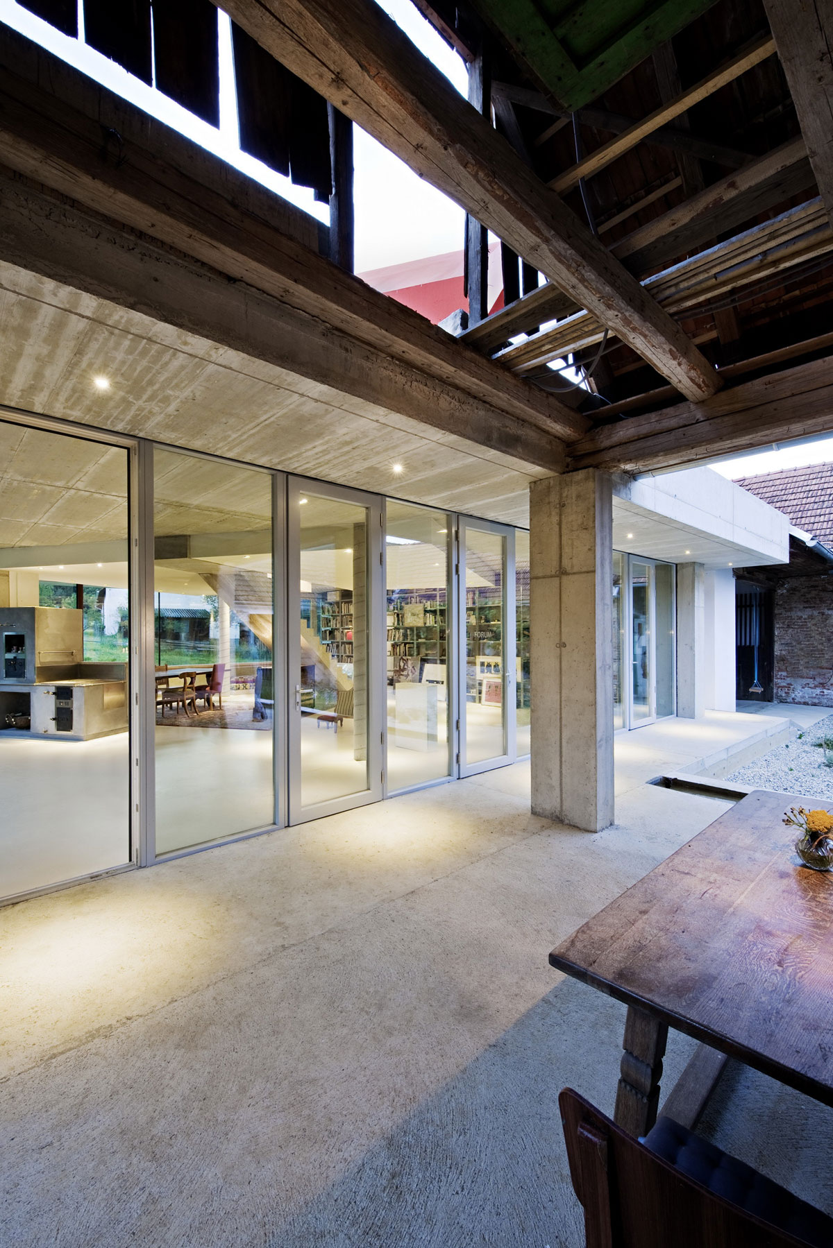 Outdoor Dining At Sleek Outdoor Dining Area Design At FORUM Limbach Applied Wooden Dining Table And Chairs With Beams Ceiling  Stylish And Sophisticated Concrete Home With Contemporary Style Interiors