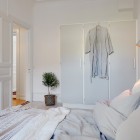 Bedroom Inside Apartment Small Bedroom Inside The Swedish Apartment Design With White Door And Closet Applied Traditional Wall Lamps Apartments Stylish Swedish Interior Style Apartment With Wooden Furniture Accents