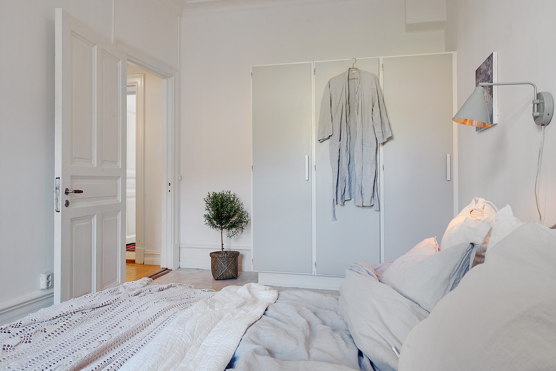 Bedroom Inside Apartment Small Bedroom Inside The Swedish Apartment Design With White Door And Closet Applied Traditional Wall Lamps Apartments Stylish Swedish Interior Style Apartment With Wooden Furniture Accents