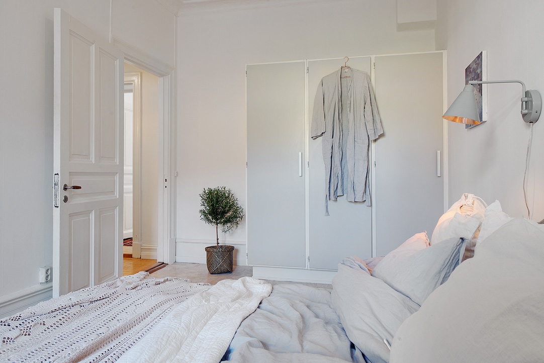 Bedroom Inside Apartment Small Bedroom Inside The Swedish Apartment Design With White Door And Closet Applied Traditional Wall Lamps Apartments  Stylish Swedish Interior Style Apartment With Wooden Furniture Accents