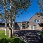 Park City Group Spacious Park City Residence Jaffa Group Carport And Lawn Completed With Leafy Trees For Shady Look Dream Homes Captivating Home Design With Grey Exterior Surrounded By Green Lawn