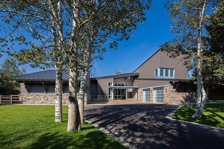 Park City Group Spacious Park City Residence Jaffa Group Carport And Lawn Completed With Leafy Trees For Shady Look  Captivating Home Design With Grey Exterior Surrounded By Green Lawn