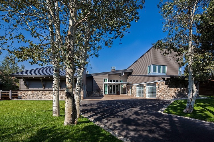 Park City Group Spacious Park City Residence Jaffa Group Carport And Lawn Completed With Leafy Trees For Shady Look Bedroom Captivating Home Design With Grey Exterior Surrounded By Green Lawn