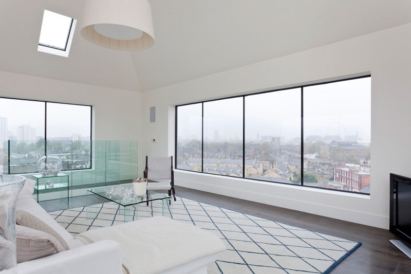 White Living The Spacious White Living Room Of The Water Tower Residence With Modular Pendant Above White Sofa And Glass Coffee Table Dream Homes  An Old Water Tower Converted Into A Luminous Modern Home With Sliding Glass Walls