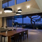 Pendant Lights Dining Sparkling Pendant Lights Above Wood Dining Table And Dark Chairs Dark Bed Sofa Glass Door Stone Wall In Skyline House Dream Homes Affordable Modern Prefabricated Home With Concrete And Glass Structures
