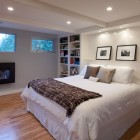 Basement Bedroom Modern Stunning Basement Bedroom Ideas With Modern Gas Fireplace Large Bookcase Cozy White Bed Shiny Ceiling Lights Bedroom 20 Creative Basement Bedroom Ideas For Perfect Modern Decorations