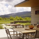 Centerpiece On Table Stunning Centerpiece On Wooden Dining Table Completed With Gray Dining Chairs On Gray Tiled Floor Of Peaks View Residence Architecture Beautiful Contemporary Home With Outdoor Dining Room And Semi-Open Terrace