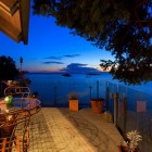 Modular Glass With Stunning Modular Glass Dining Table With Decorative Chairs Installed Outside Seaside House In Terrace With Wood Striped Floor Dream Homes Beautiful Seaside Home With Classic And Vintage Decorations