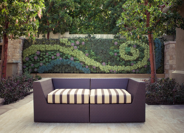 Rattan Outdoor Contemporary Stunning Rattan Outdoor Sofa In Contemporary Patio Exterior Design Installed On Wooden Striped Floor And Striped Bedding Chair Decoration  Various Outdoor Sofa Furniture For Modern Home Exteriors